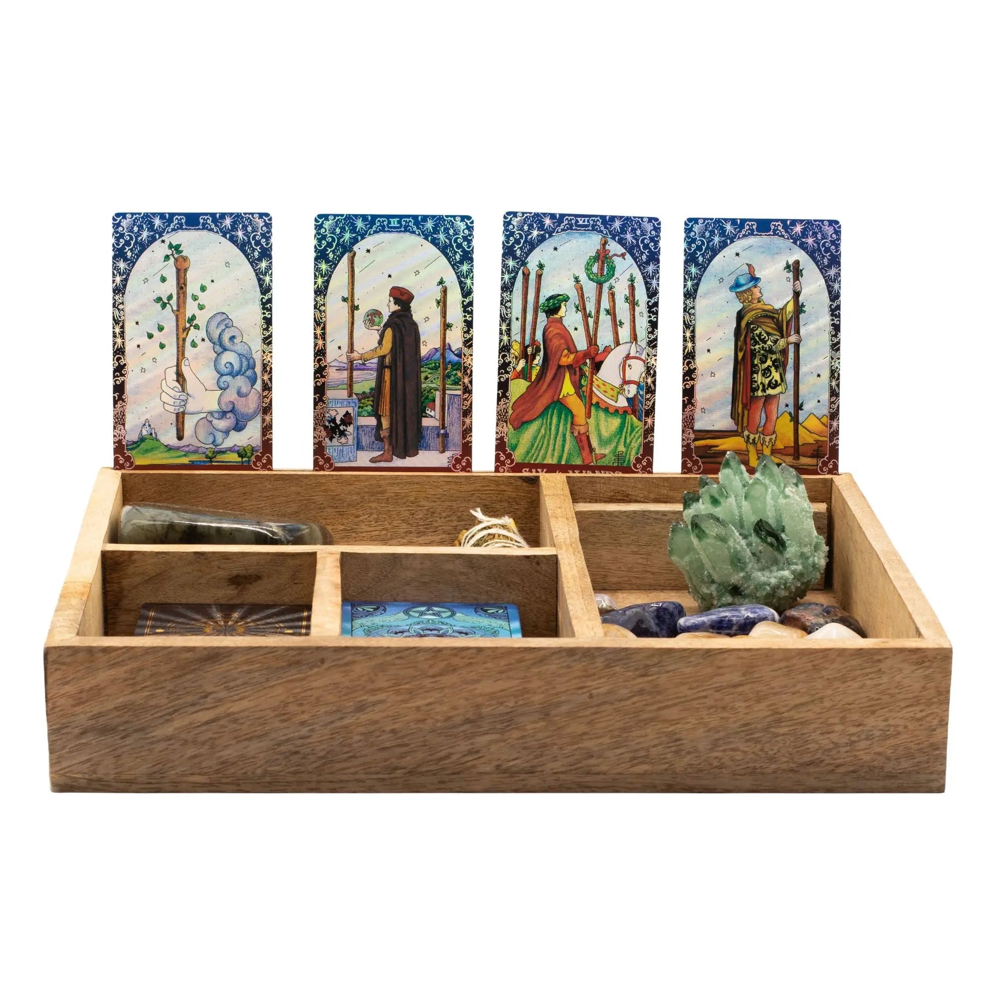 Wooden tray with tarot cards and crystals on a white background