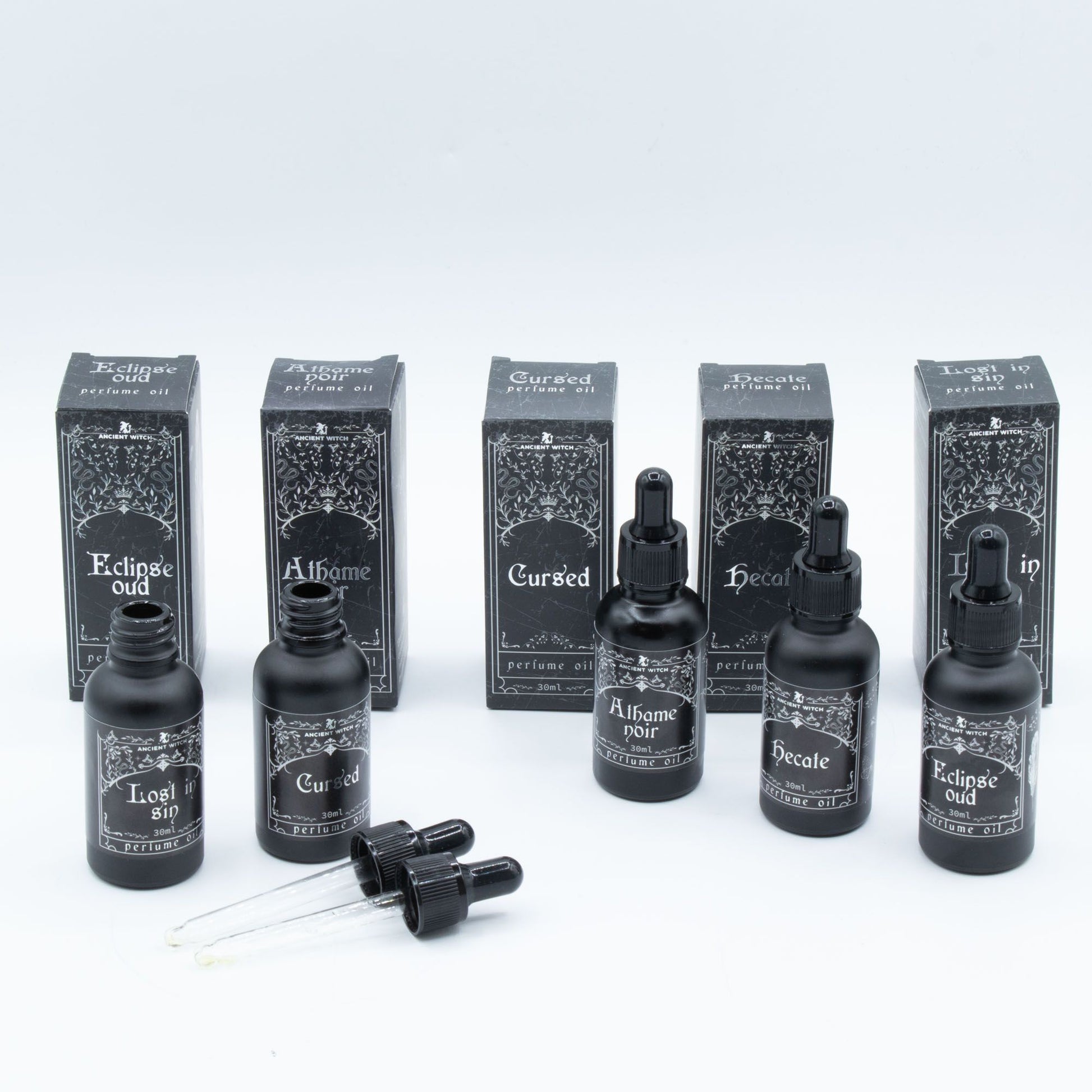 Collection of black bottles and boxes with text on a white background