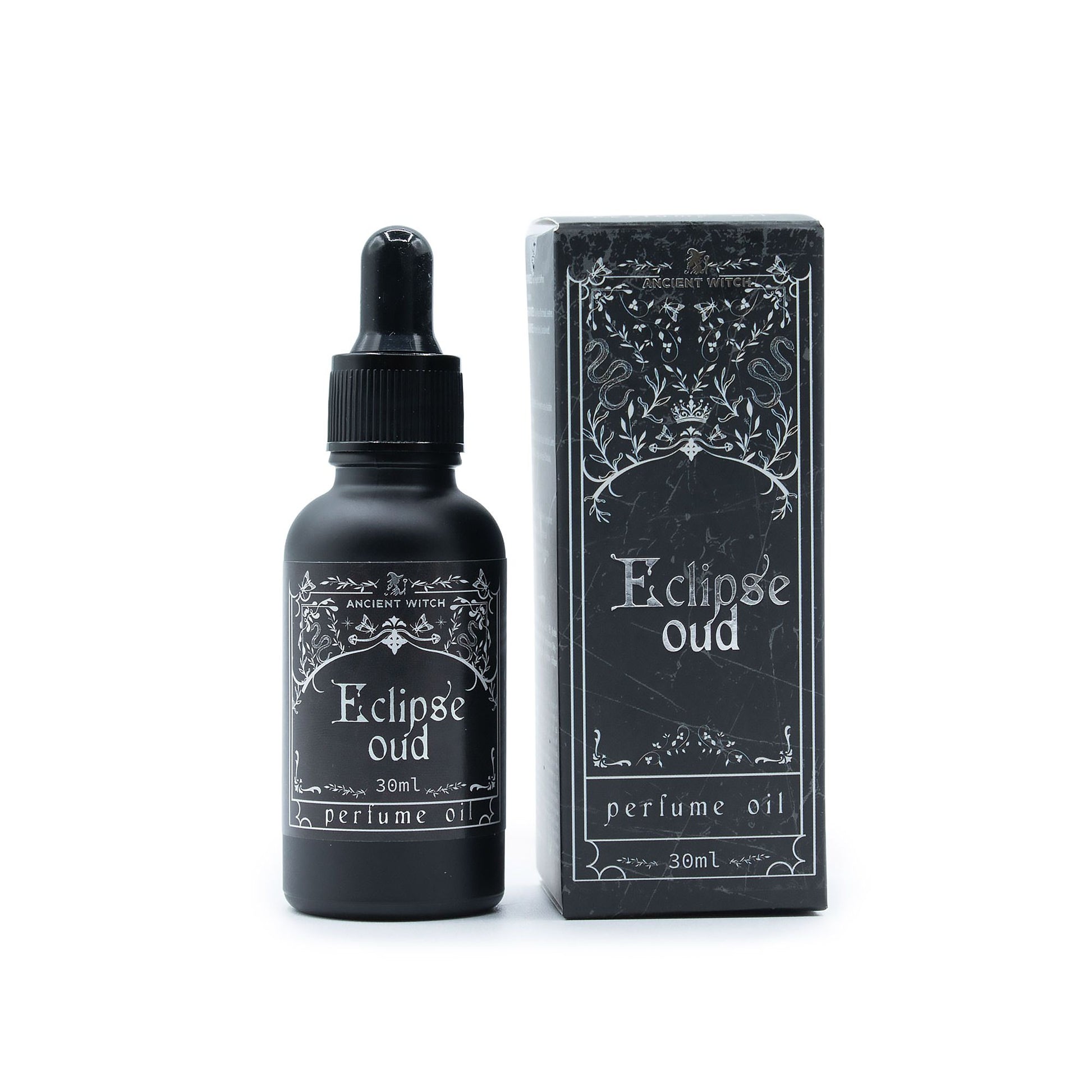 Eclipse oud perfume oil bottle and packaging on a white background