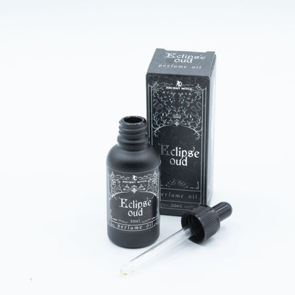 Eclipse Oud perfume oil bottle and packaging on a white background