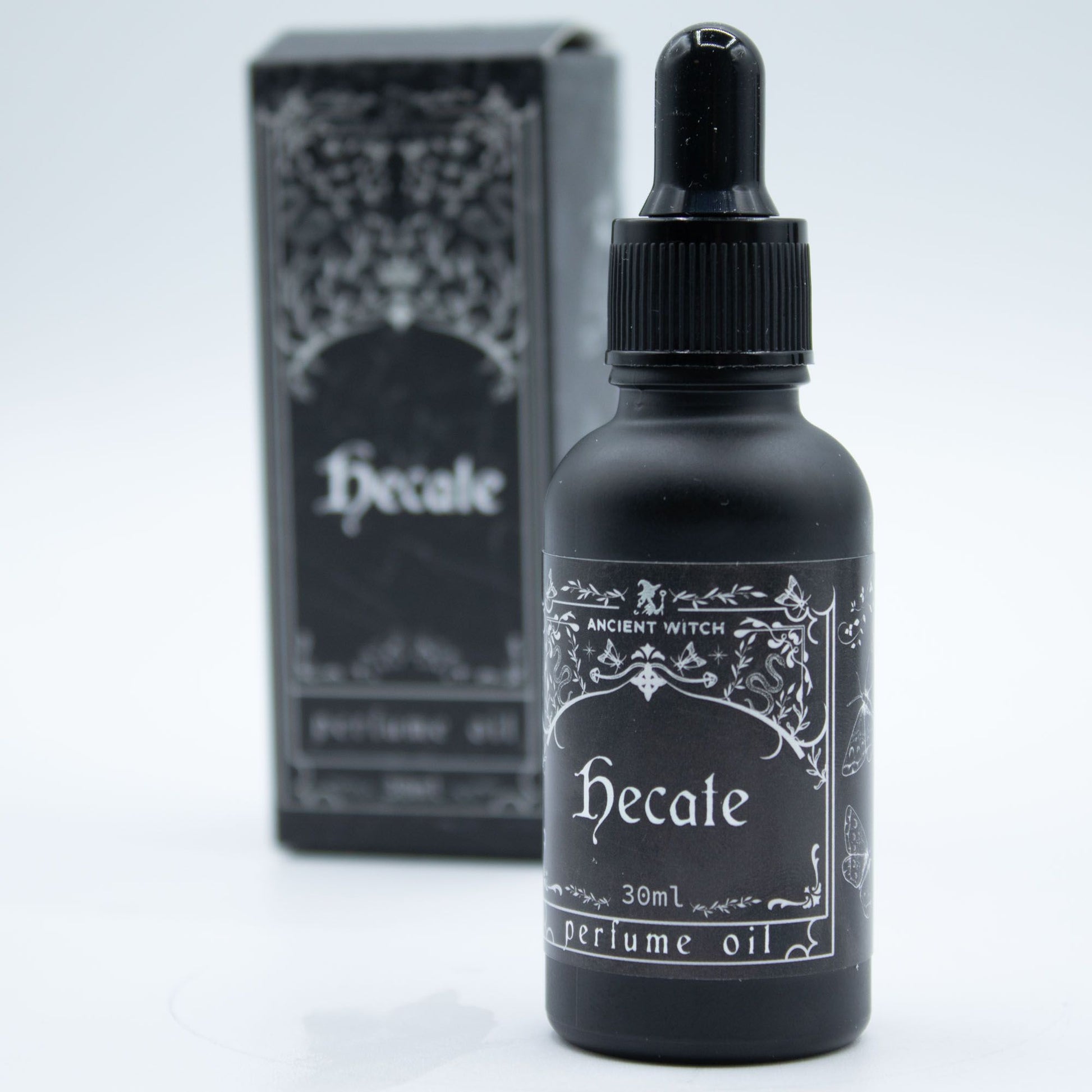 Hecate perfume oil bottle with packaging on a light gray background