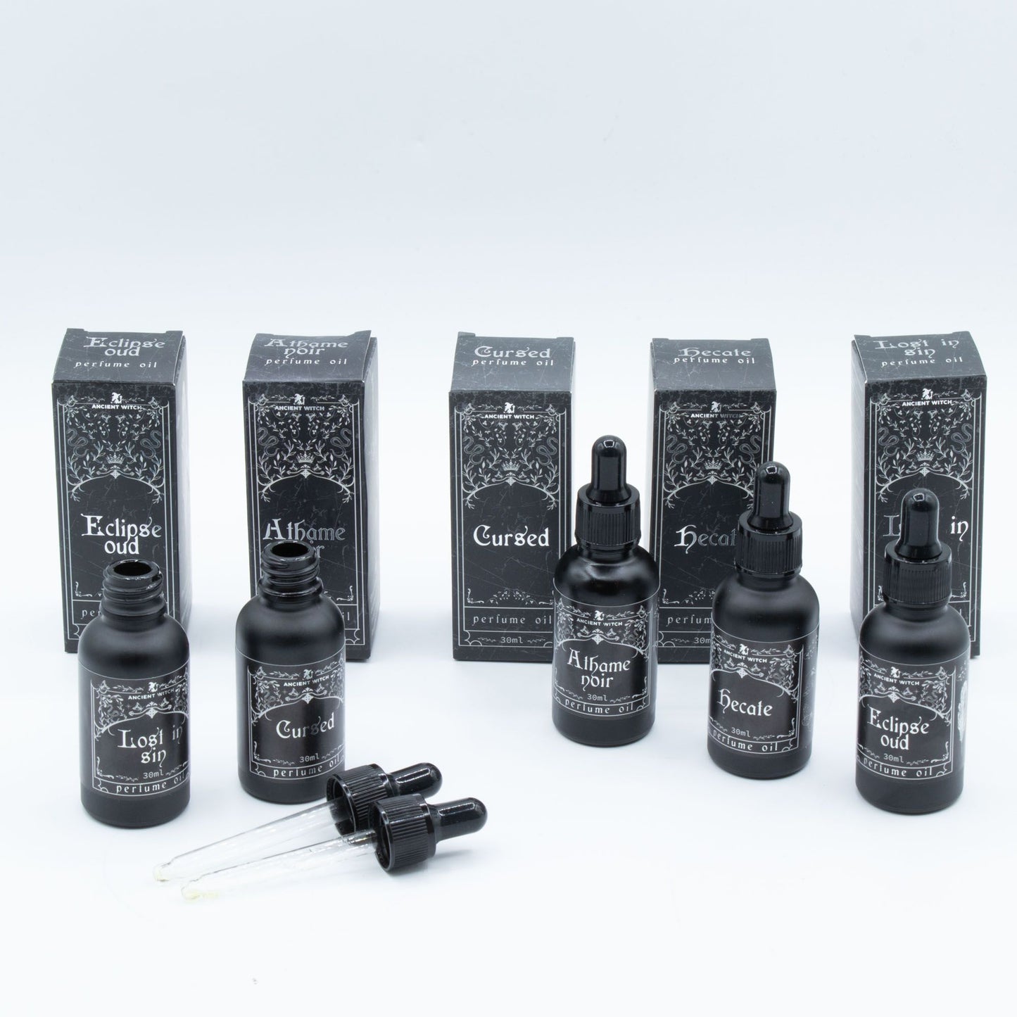 Collection of black bottles and boxes with text on a white background