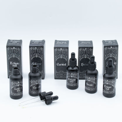 Collection of black bottles and boxes with text on a white background