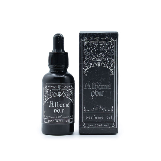 Black perfume oil bottle and packaging with 'Athame noir' branding on a white background