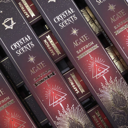Stack of 'Crystal Scents' and 'Agate Saffron' products with decorative labels.