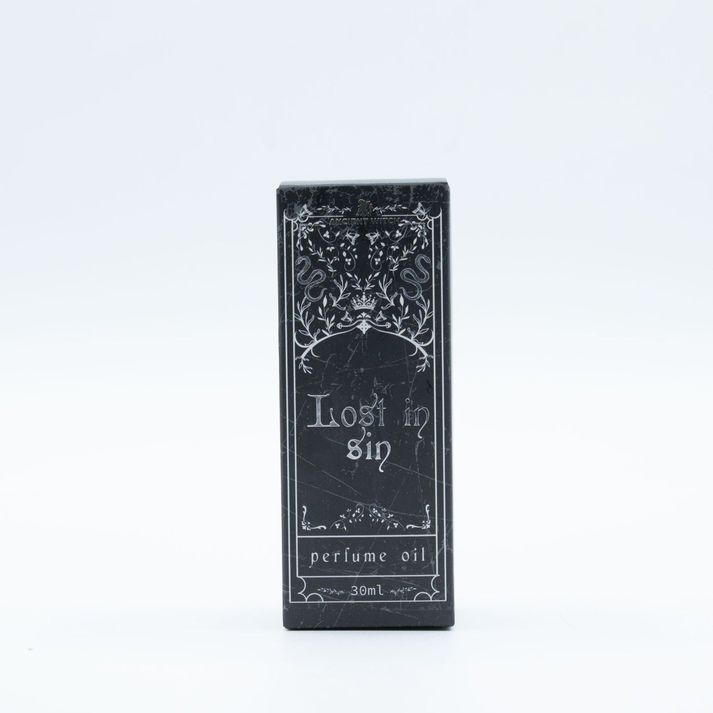 Black packaging of 'Lost in Sin' perfume oil on a white background