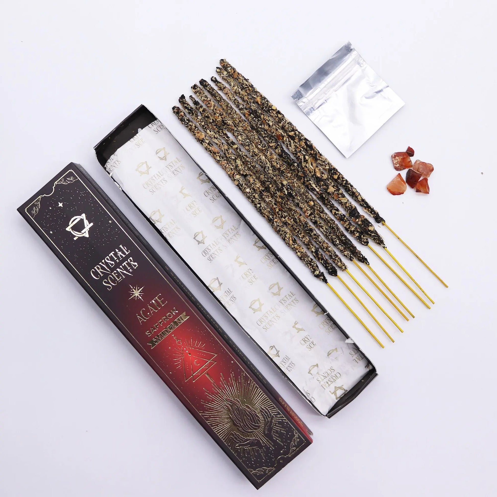 Incense sticks with packaging labeled 'Crystal Scents' on a white background
