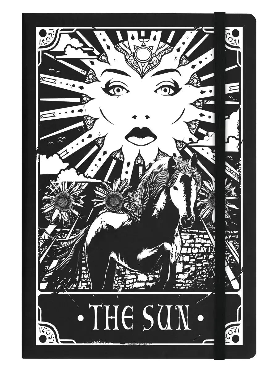 Notebook cover with black and white design of a woman, horse, and sun, labeled 'The Sun'.