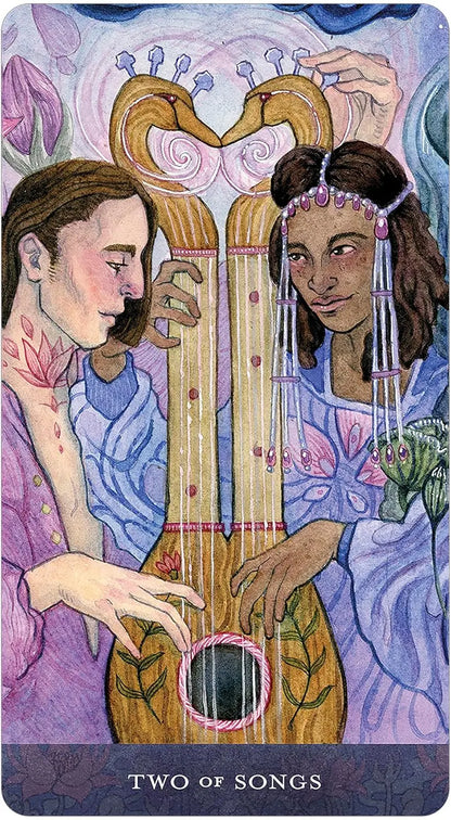 Blood Moon Tarot deck by Sam Guay with burgundy edged tarot cards and hardcover guidebook.