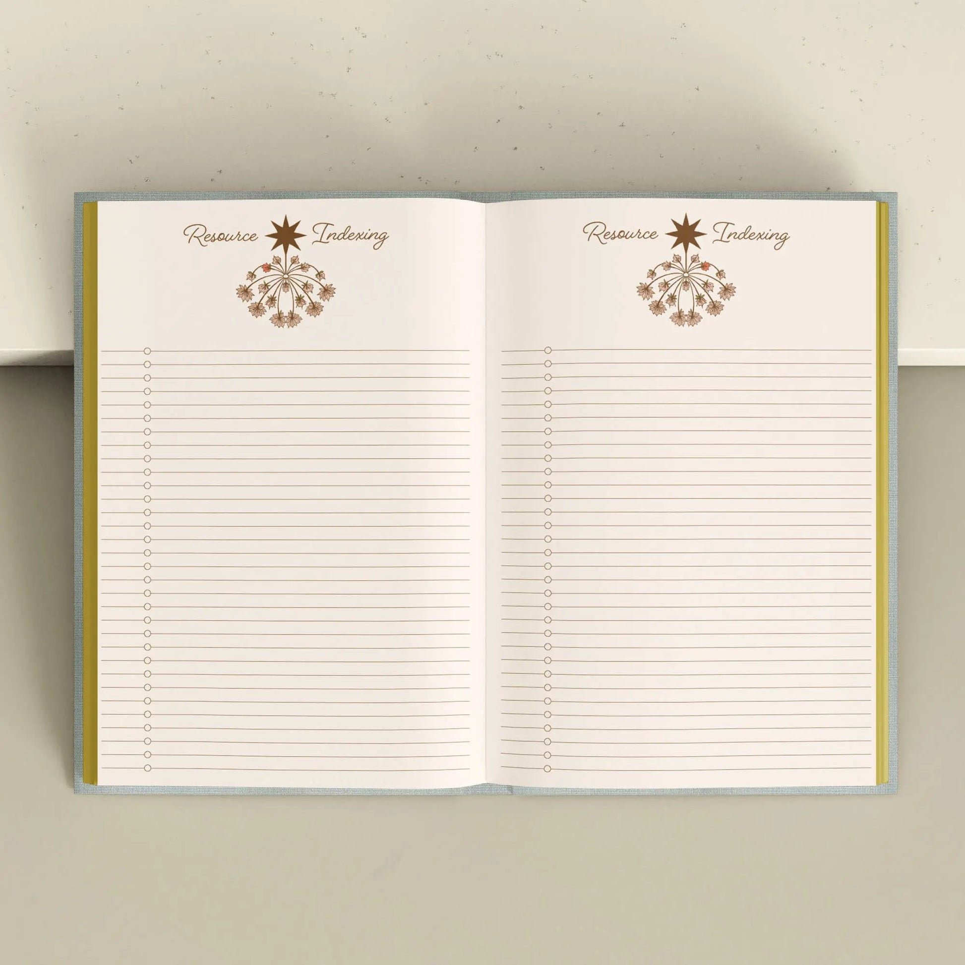 Open notebook with lined pages and decorative elements on a neutral background Crystal companion journal by Bouchette and Co available from Oneness Emporium