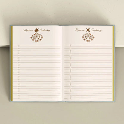 Open notebook with lined pages and decorative elements on a neutral background Crystal companion journal by Bouchette and Co available from Oneness Emporium