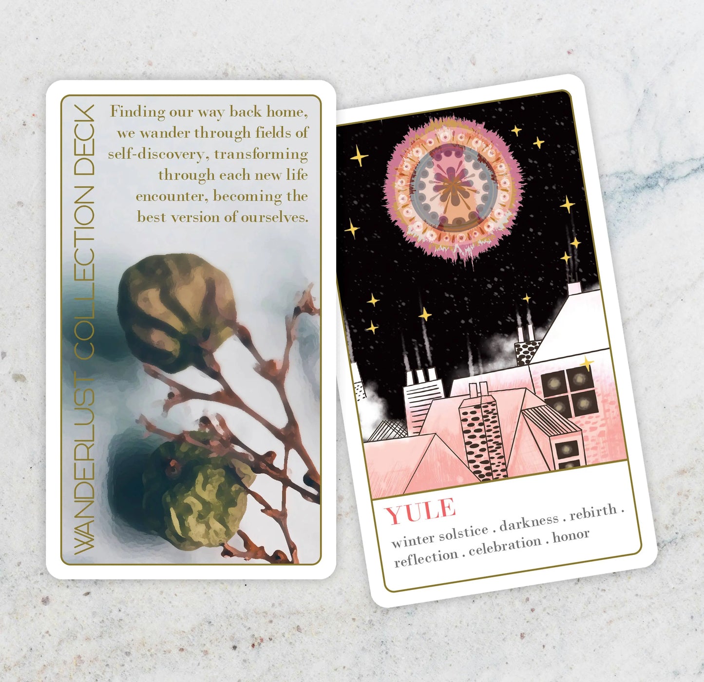 Two tarot cards from the Wanderlust Collection oracle Deck on a textured surface.