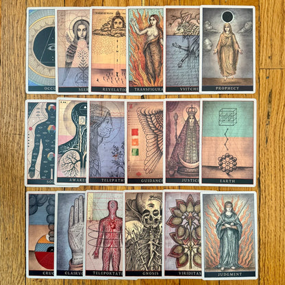 Collection of tarot cards on a wooden surface Codex by Daniel Martin Diaz Oneness Emporium