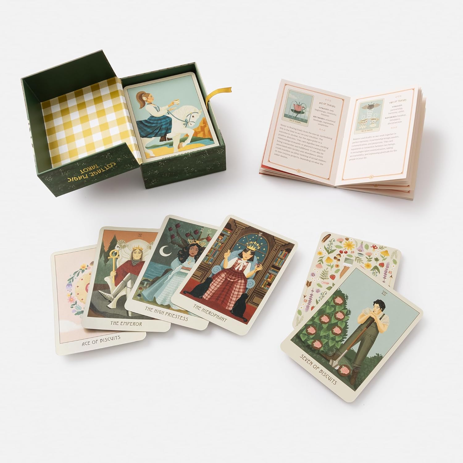 Set of tarot cards with a box and booklet on a white background