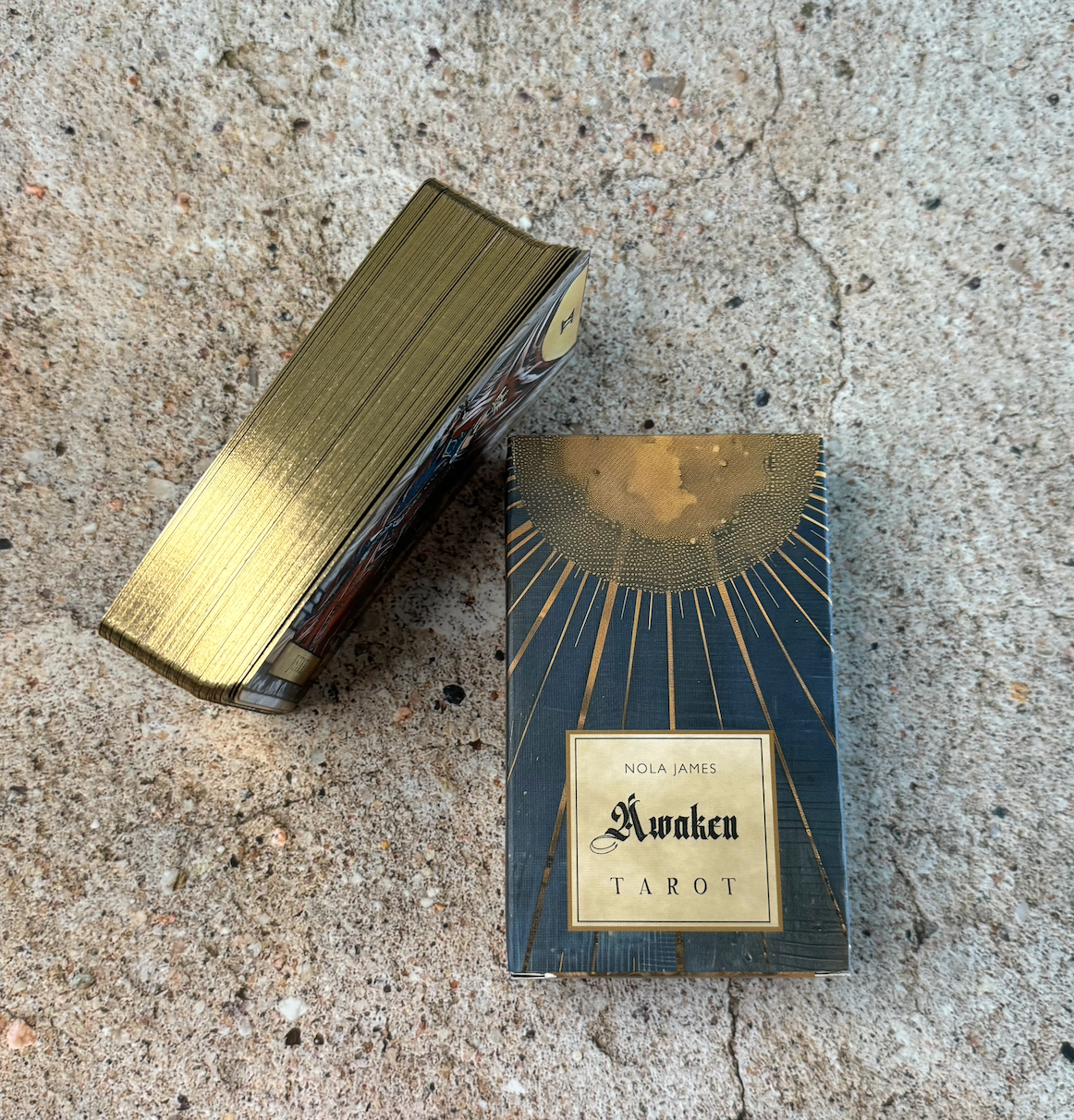 Nola James Awaken Tarot box on a textured surface