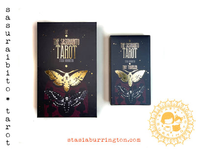 Two tarot card boxes with butterfly designs on a white background, featuring the brand 'sasurai bito tarot' and a website address.