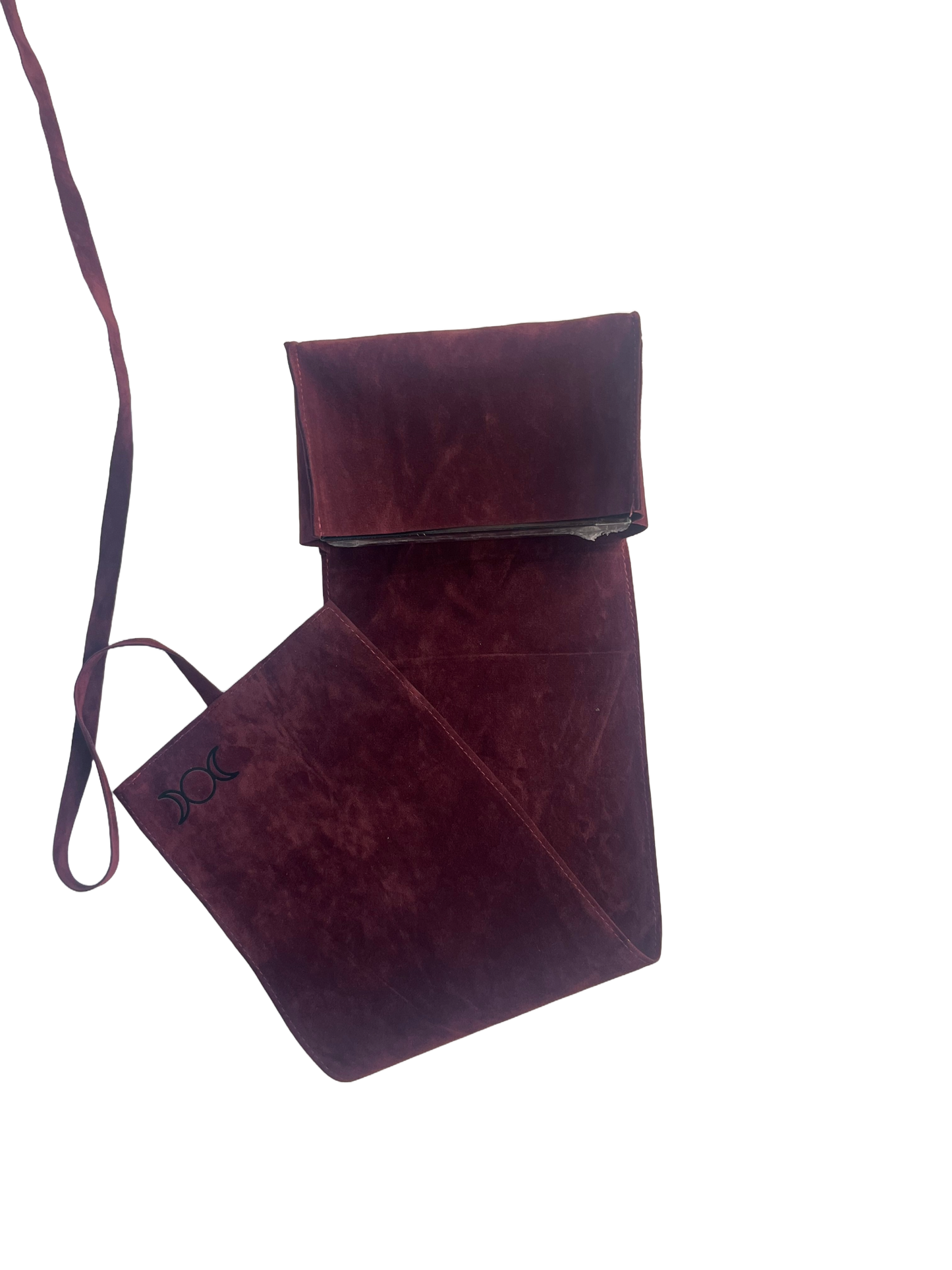 Burgundy leather bag with strap on a white background