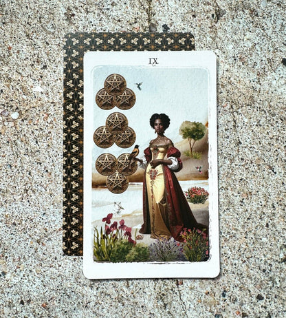 A tarot card laid flat on a textured stone surface, showing the IX of Wands with a woman in a red and gold dress beside stacked wands, with the patterned backing card partially visible behind it.