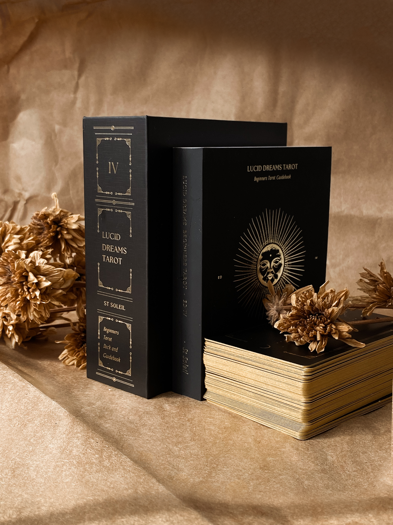 Lucid Dreams Beginner's Tarot Black Eclipse Edition IV by ST. SOLEIL featuring matte black cards with gold foil details, premium linen finish and magnetic keepsake box.