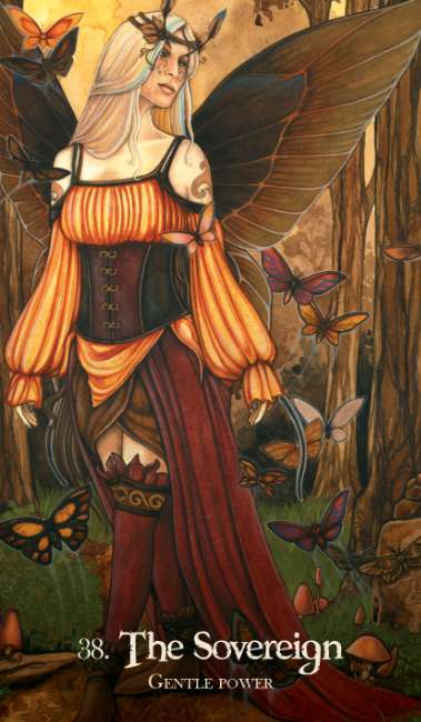 Illustration of a woman with butterfly wings surrounded by butterflies in a forest setting, titled 'The Sovereign'. Oracle of the Dragonfae redesigned edition oracle deck with fantasy dragon and fae themed cards.