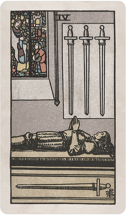 Tarot card with a figure lying down, three vertical swords above, and stained glass window on the left. Pamela Colman Smith's RWS Tarot Deck Soft Color Edition by U.S. Games Systems featuring muted vintage colours, ivory borders, and the original Rider-Waite-Smith artwork.