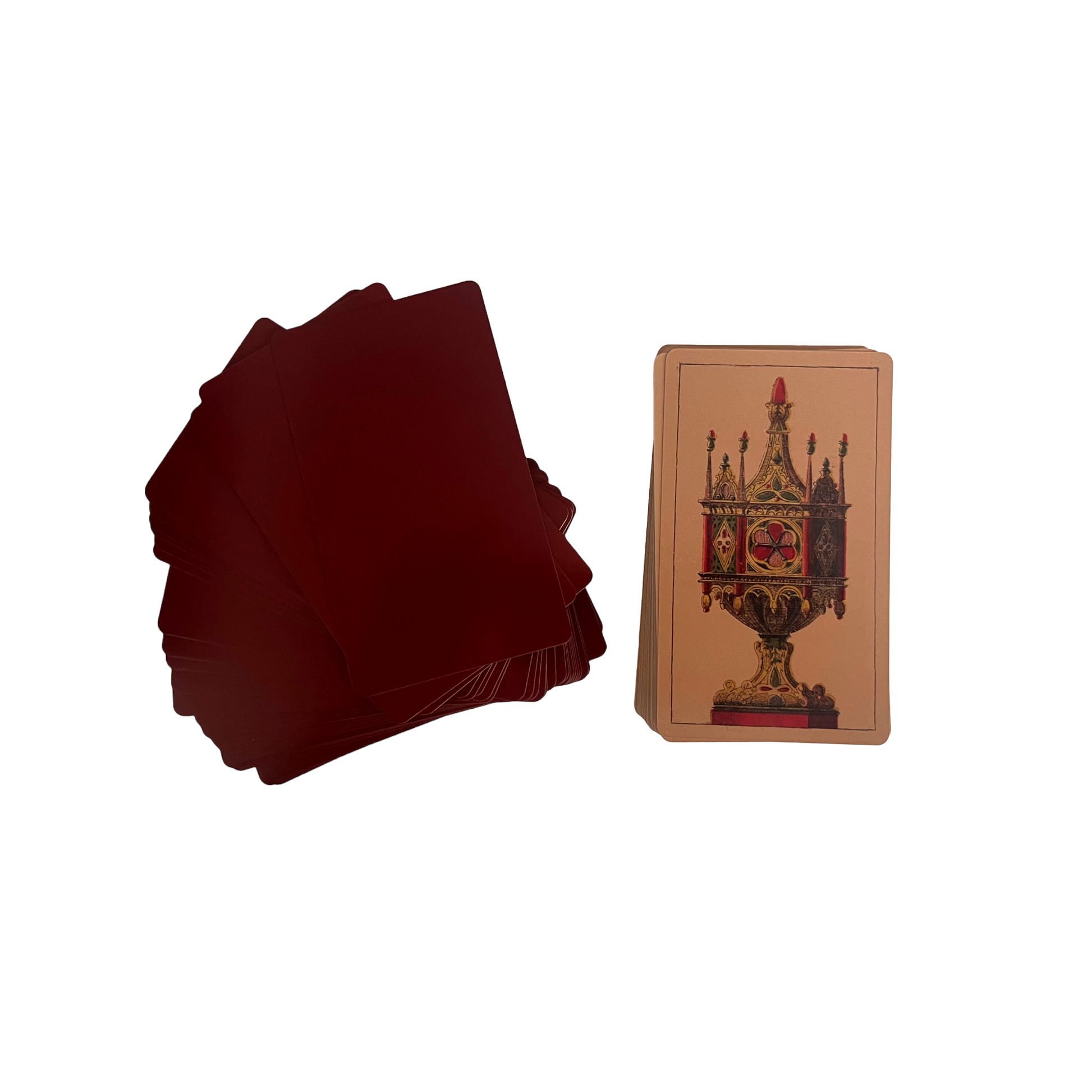 Stack of red playing cards next to a single card with intricate design on a white background Tarot Della Rocca historical Italian tarot deck based on Carlo Della Rocca's nineteenth-century Tarocco Sopraffino with 78 beautifully engraved cards and companion guide.