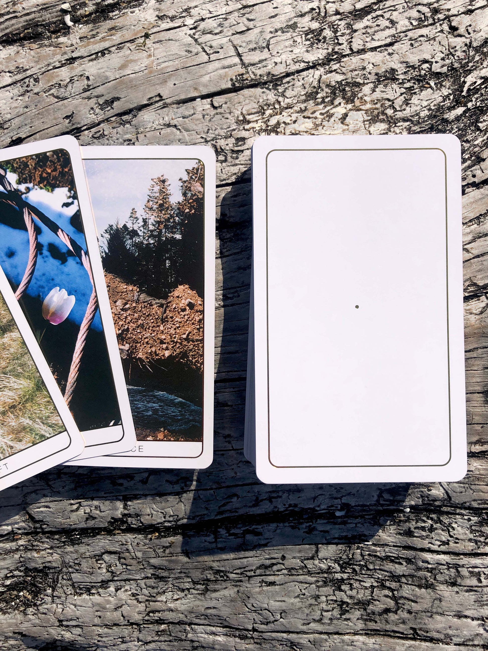 Death Doula Oracle Cards featuring original analogue 35mm photography with double exposure imagery, gold gilded edges and a guidebook for spiritual transformation and healing.