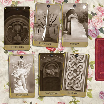 Set of tarot cards with symbolic designs on a floral background