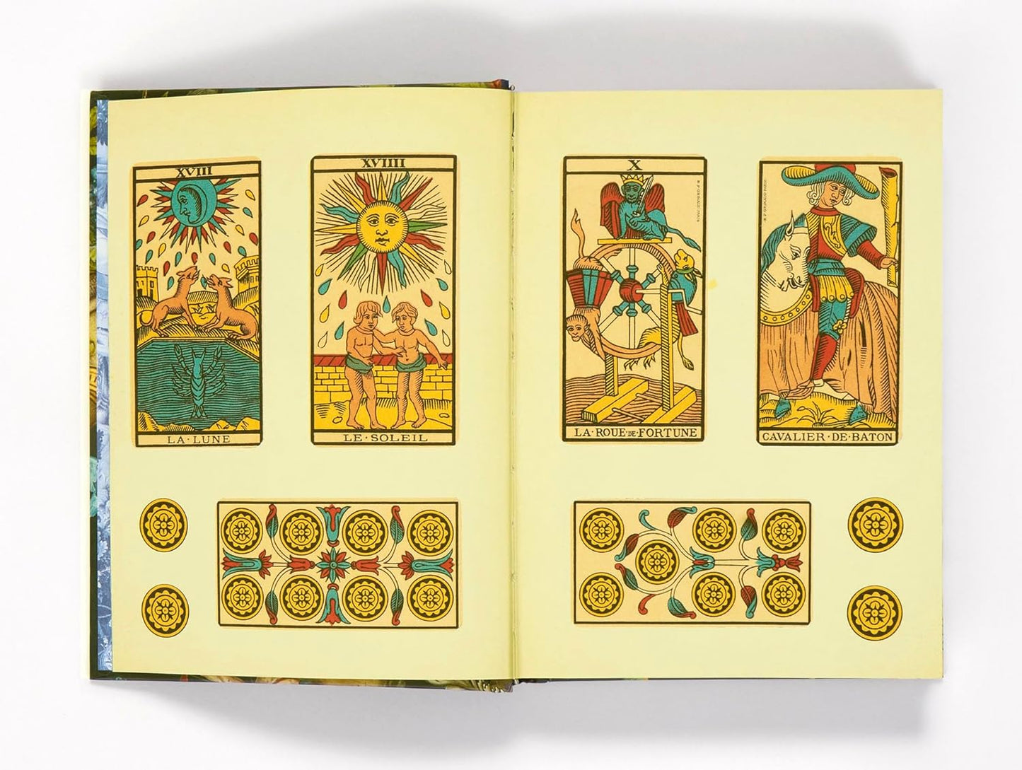 Open book displaying tarot card illustrations on a white background Esoterica sticker book