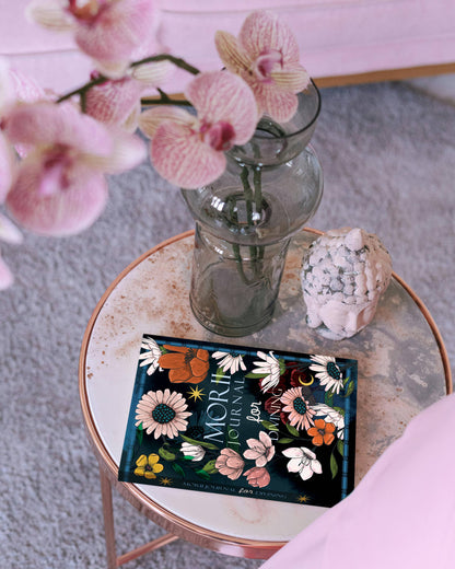 Moriori tea box with pink orchids on a small round table