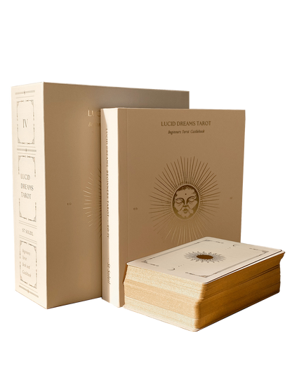 Lucid Dreams Tarot set with beige leather-bound book and card deck on a white background