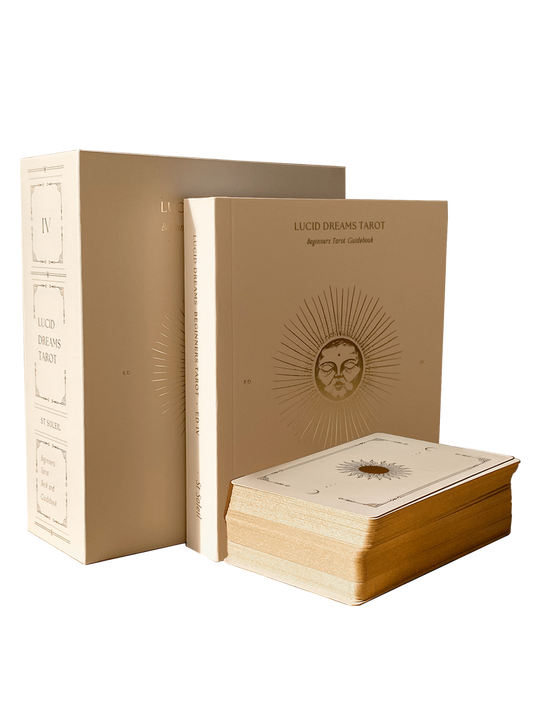 Lucid Dreams Tarot set with beige leather-bound book and card deck on a white background