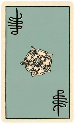 Card with a floral design and symbols on a green background