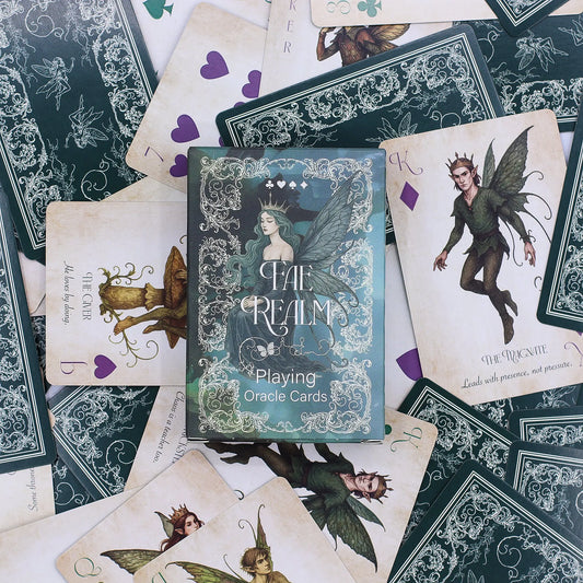 Fae Realm Oracle Cards with a box on top of other cards