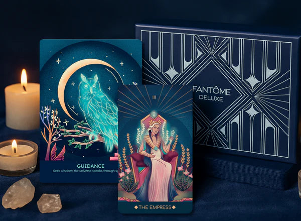 Fantème Deluxe tarot cards with candles and crystals on a dark background
