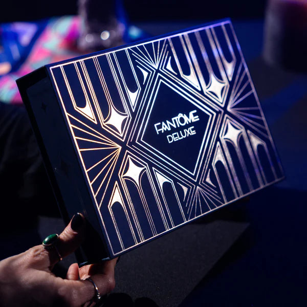 Fantom Deluxe makeup palette held by a person with a dark background