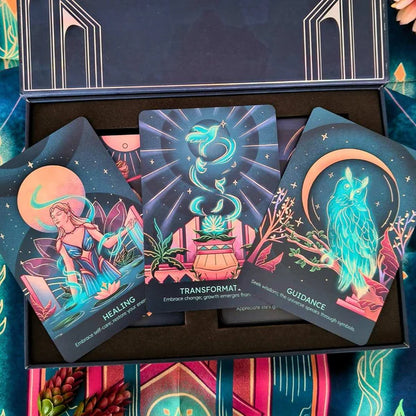 Colorful tarot cards with mystical designs on a matching box.