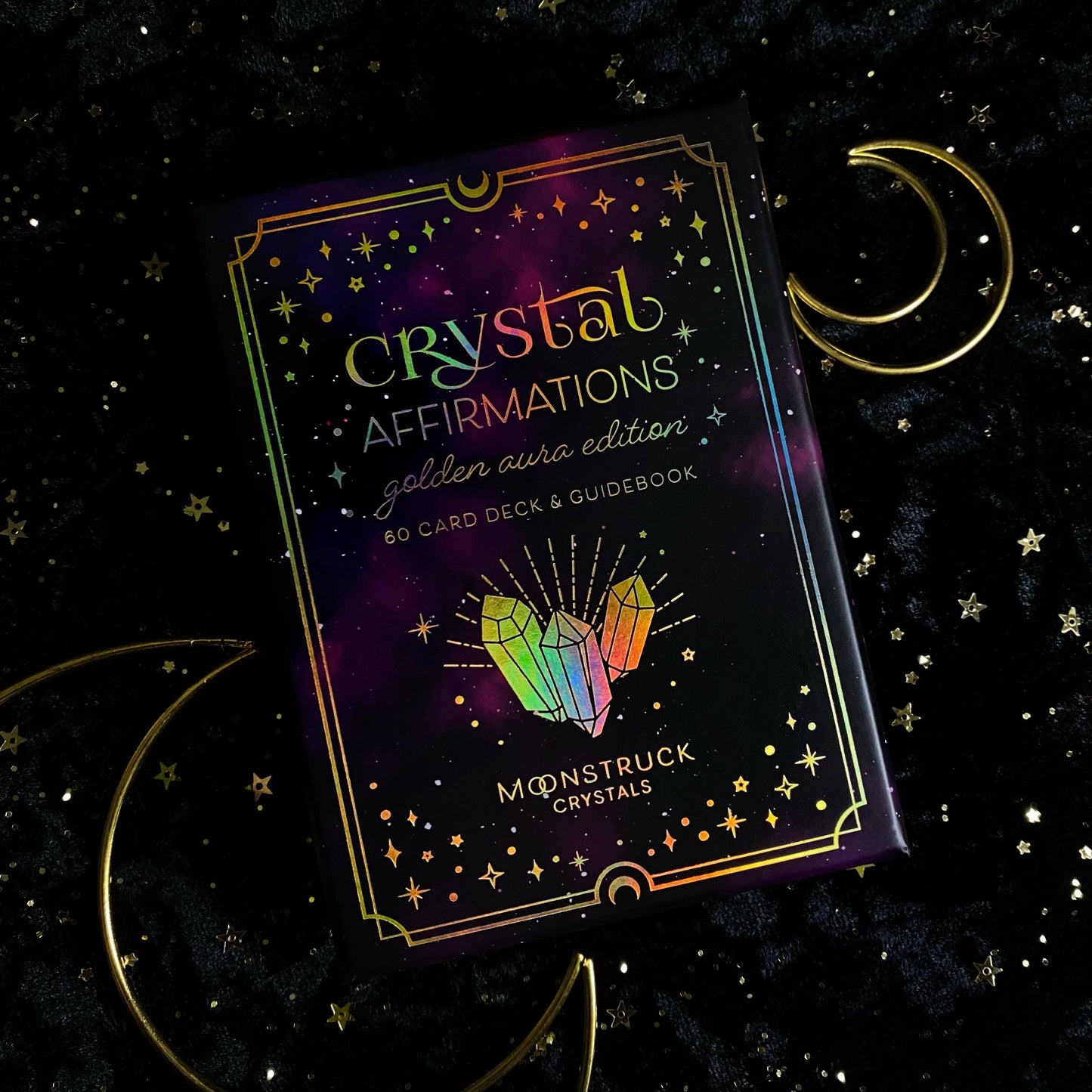 Crystal Affirmations card deck packaging with crystals and moon symbols on a dark background
