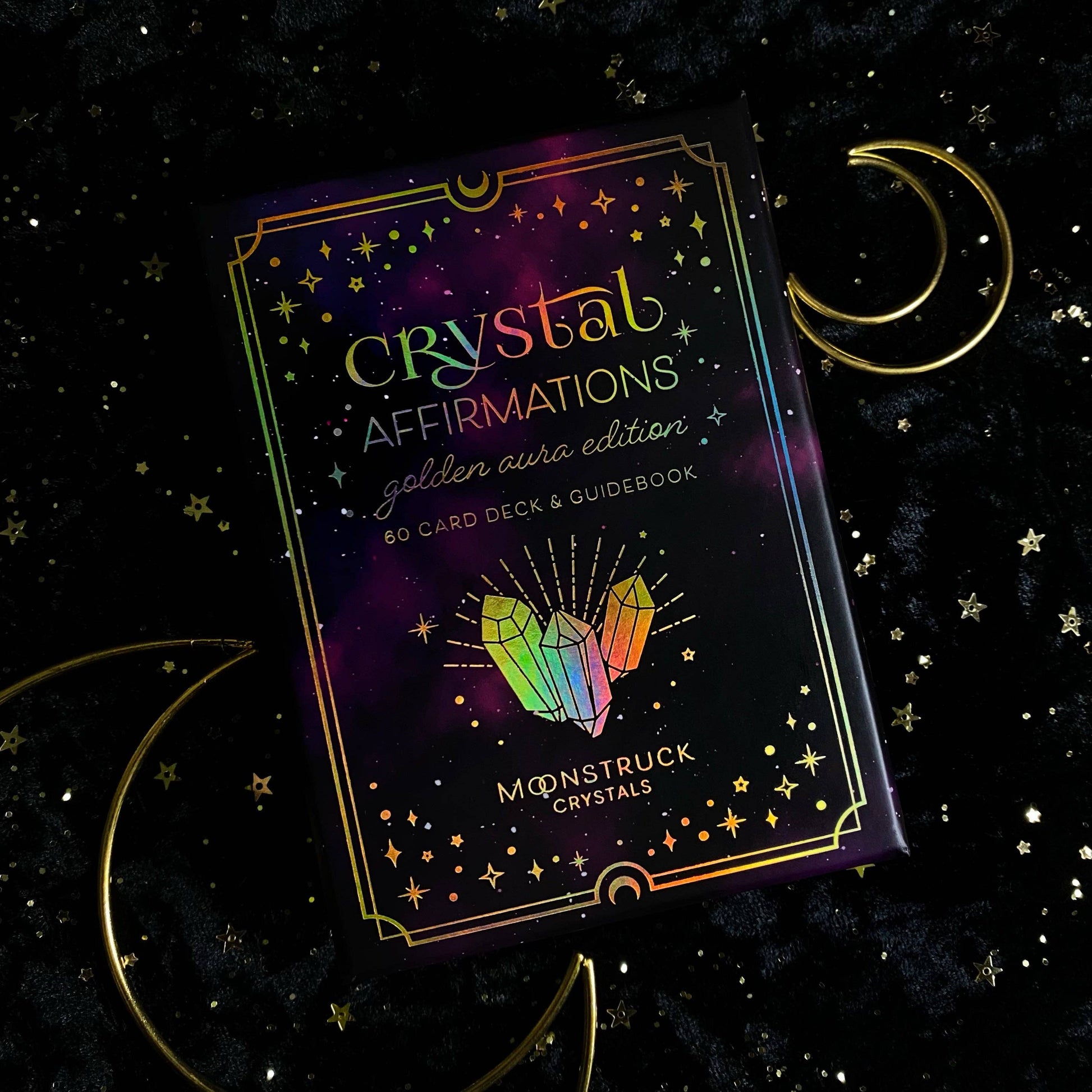 Crystal Affirmations card deck packaging with crystals and moon symbols on a dark background