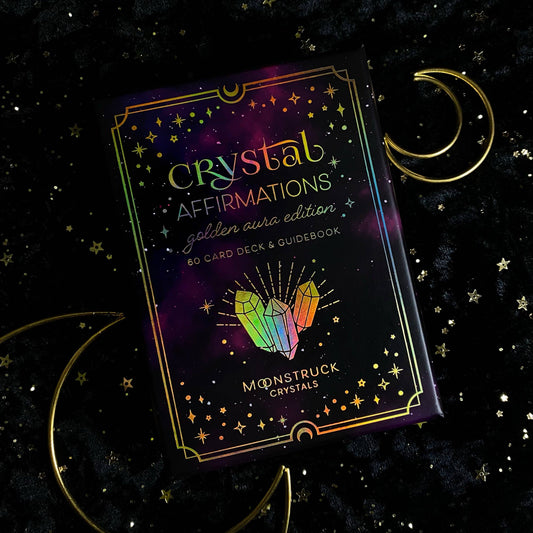 Crystal Affirmations card deck packaging with crystals and moon symbols on a dark background