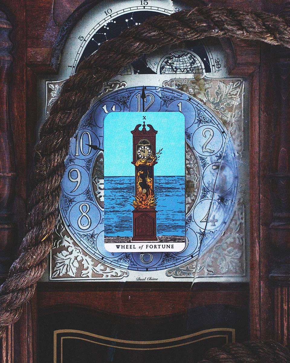 Decorative clock with 'Wheel of Fortune' tarot card design on a wooden background