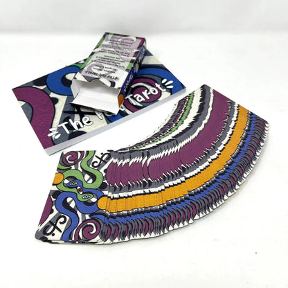 Colorful tarot card deck with packaging on a white background