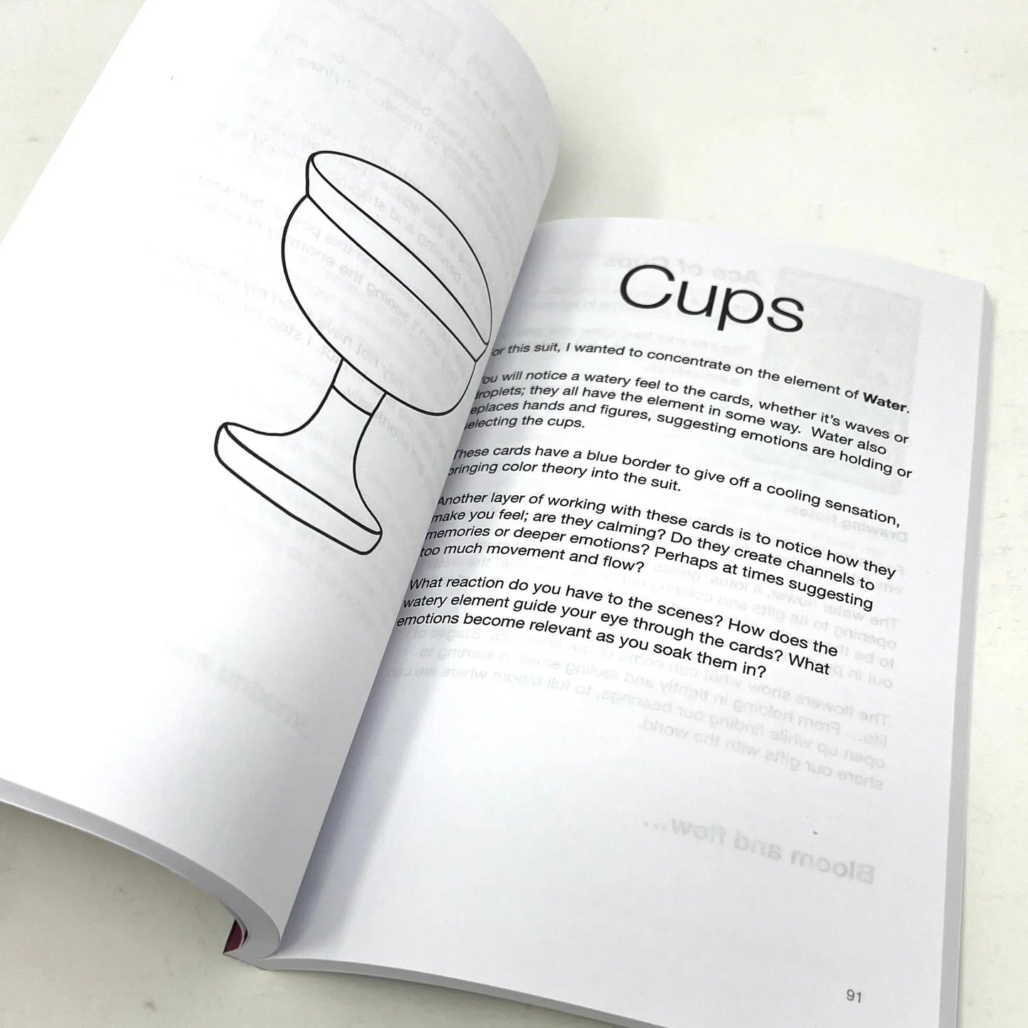 Open book with a diagram of a cup and text on a white background