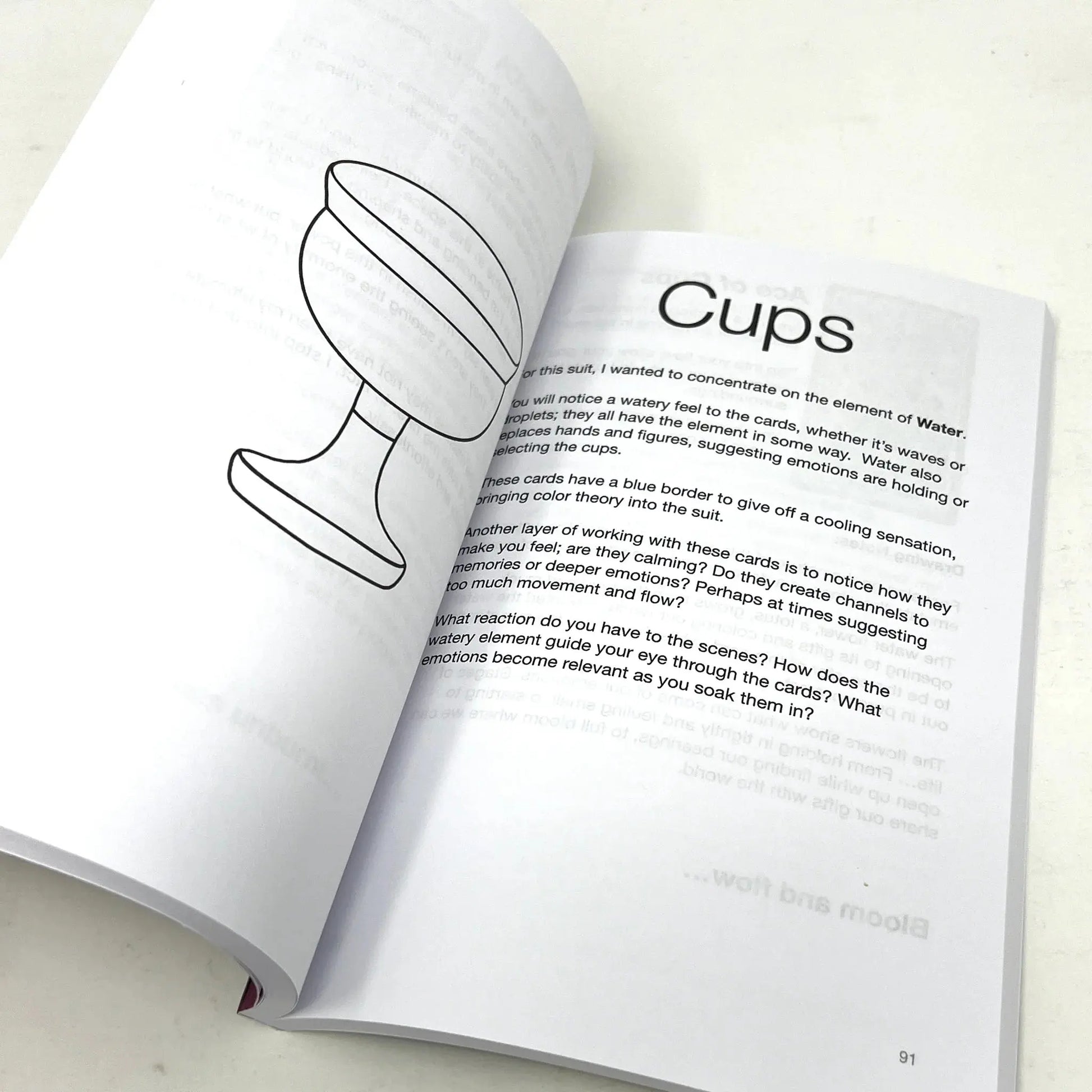 Open book with a diagram of a cup and text on a white background