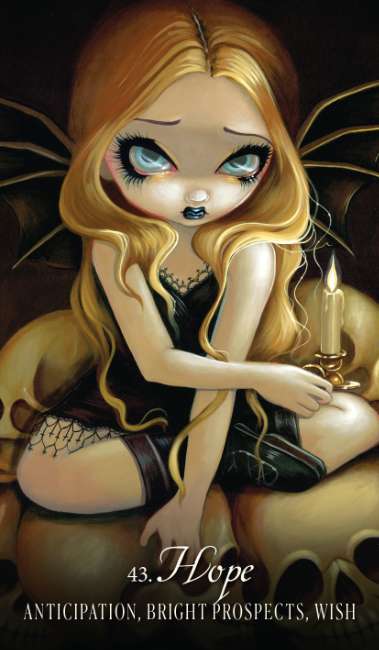 Illustration of a fairy with long blonde hair holding a candle, sitting on a skull. Les Vampires Oracle redesigned edition gothic oracle deck by Lucy Cavendish with artwork by Jasmine Becket-Griffith.