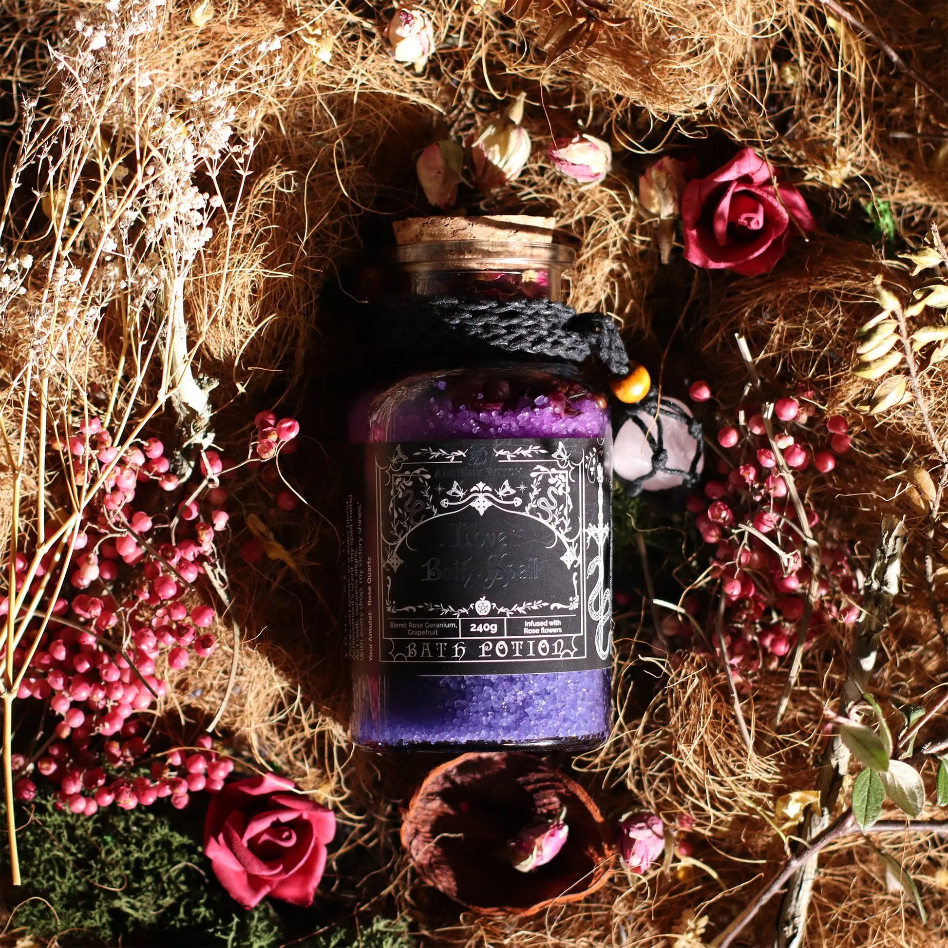Purple potion bottle labeled 'Death Potion' surrounded by flowers and hay.