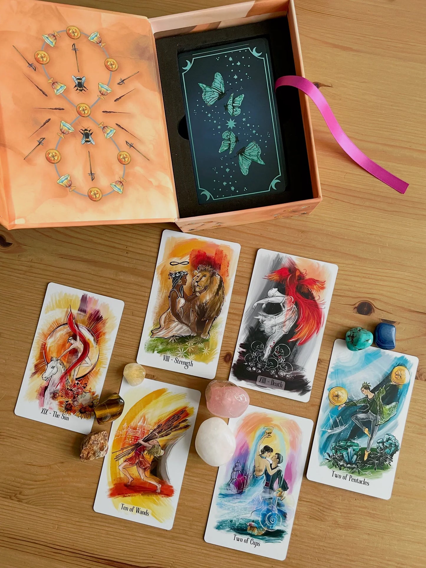 Luminous Flow Tarot first edition deck with watercolor artwork and gold detailed box.