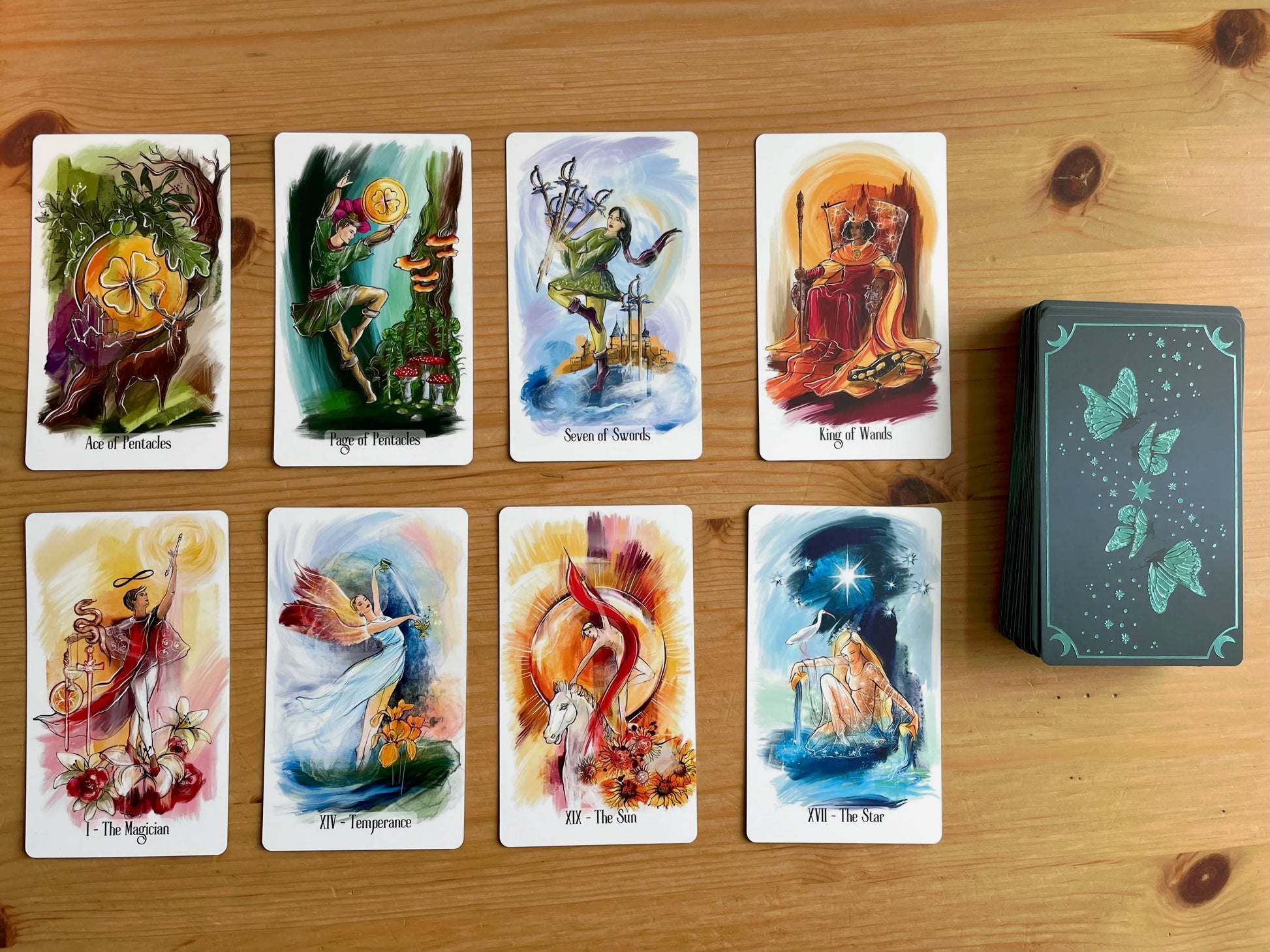 Luminous Flow Tarot first edition deck with watercolor artwork and gold detailed box.
