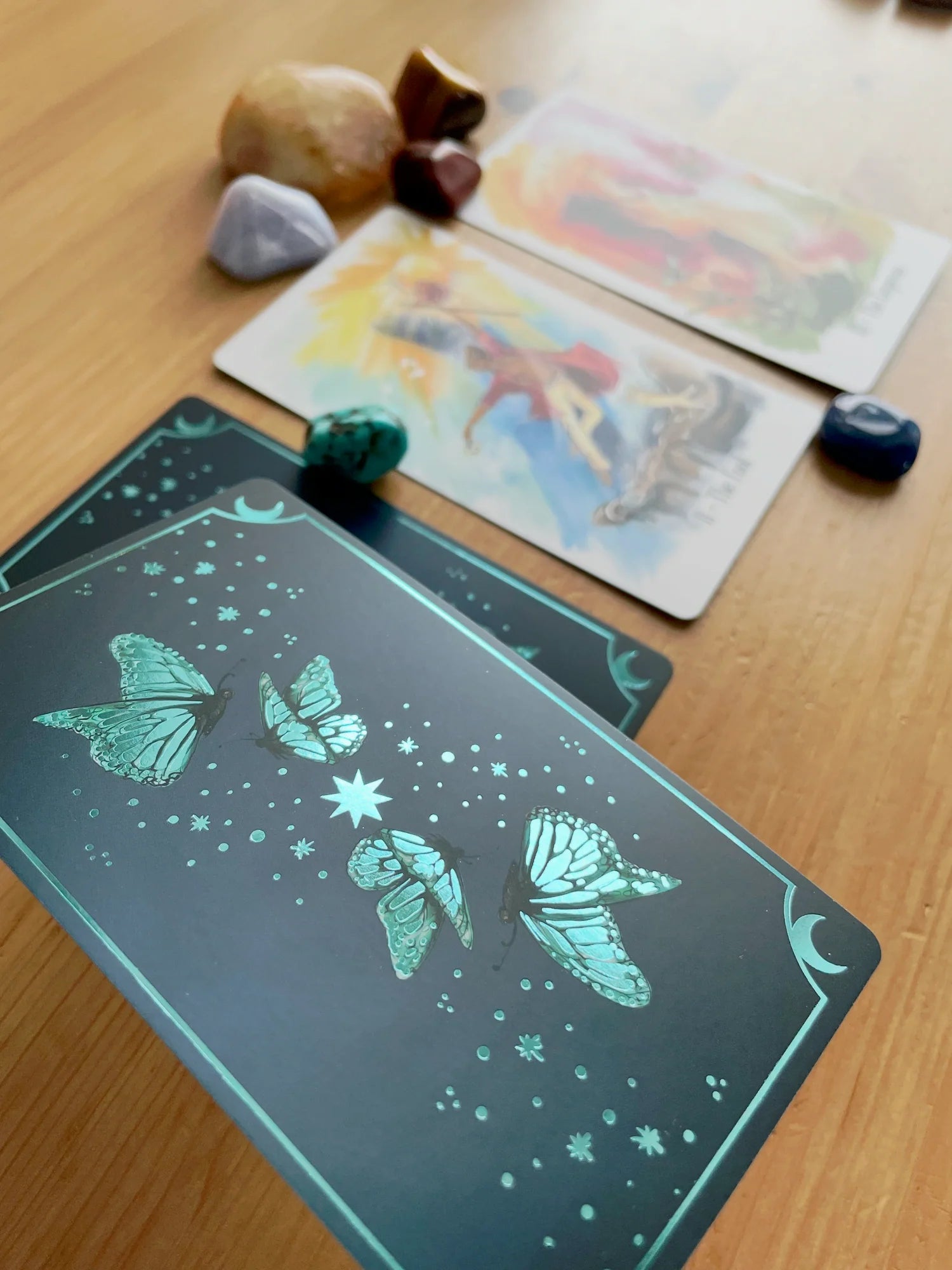 Luminous Flow Tarot first edition deck with watercolor artwork and gold detailed box.