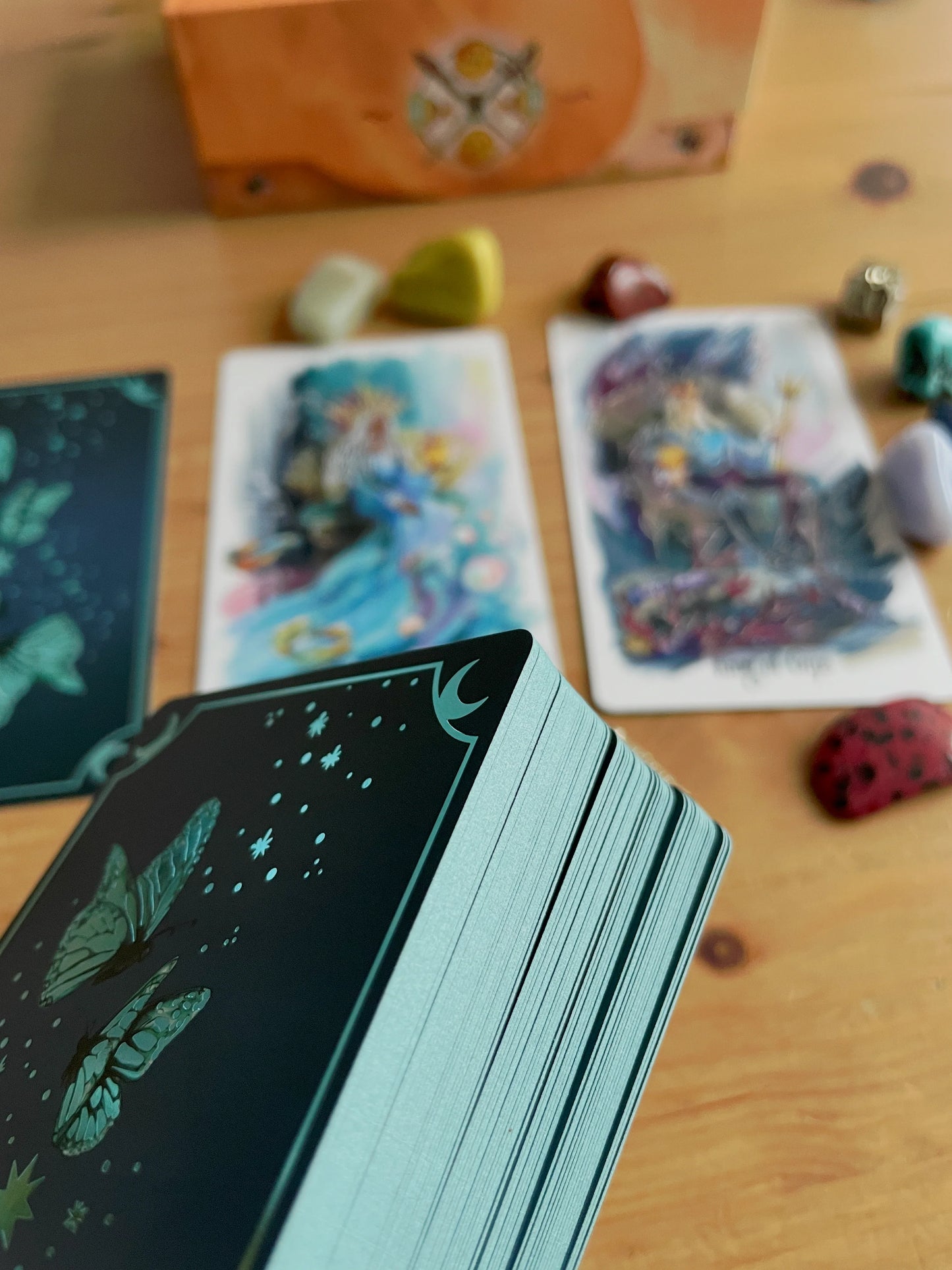 Luminous Flow Tarot first edition deck with watercolor artwork and gold detailed box.